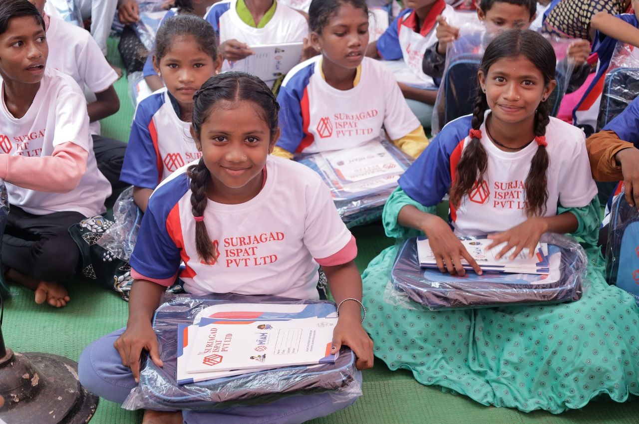 Girl students in Surjagad receiving MIAM school kits