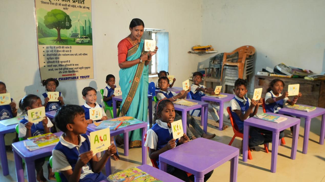 Teacher conducting interactive alphabet class