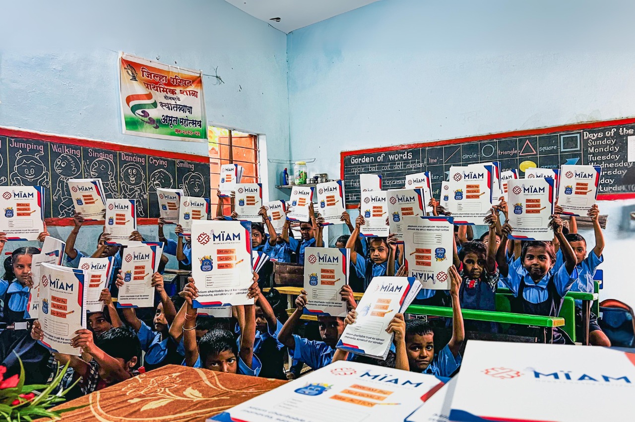 Students receiving MIAM study materials in classroom