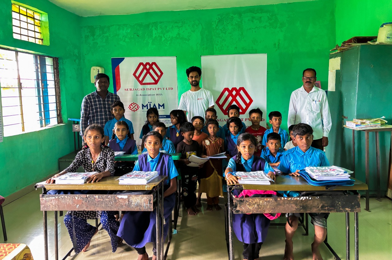 MIAM study material distribution — tribal classroom, Gadchiroli