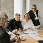 A diverse group of business professionals engaged in a strategic meeting.