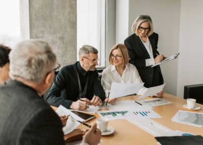 A diverse group of business professionals engaged in a strategic meeting.